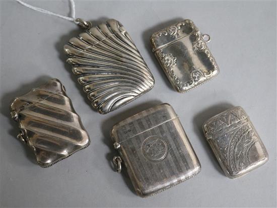 Five assorted silver vesta cases.